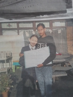 Sekeena and her daughter Lynette with research of the Windrush Scandal Folder
